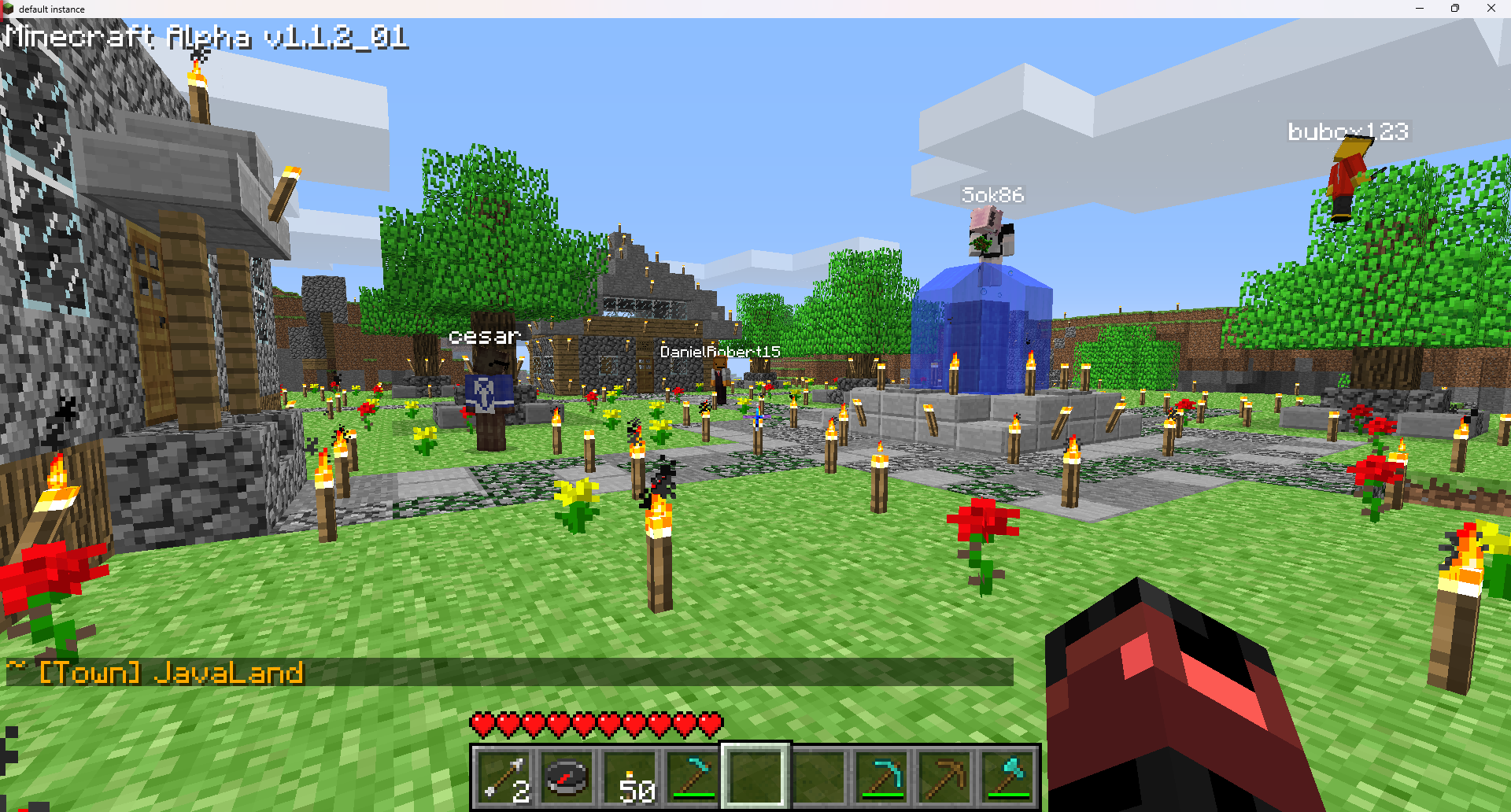 Players around a fountain at the spawn town