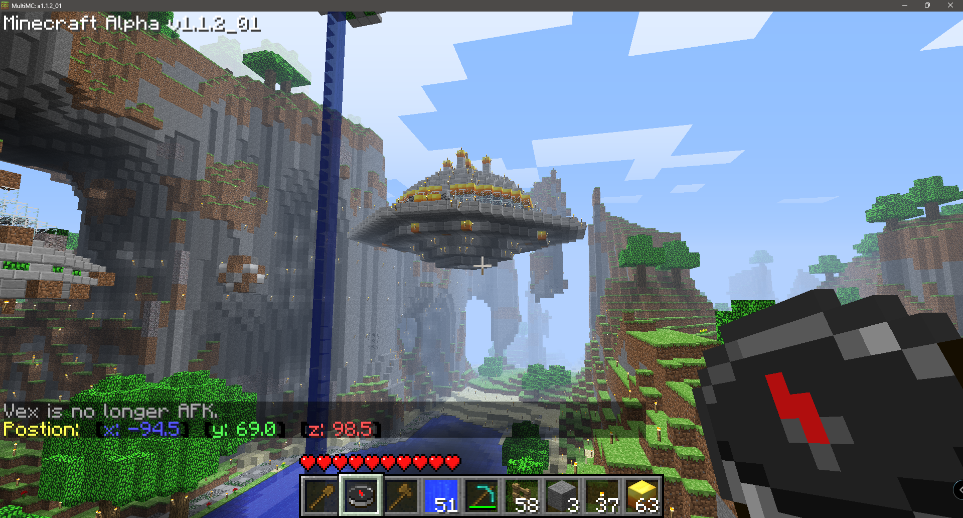 A floating build among tall mountains